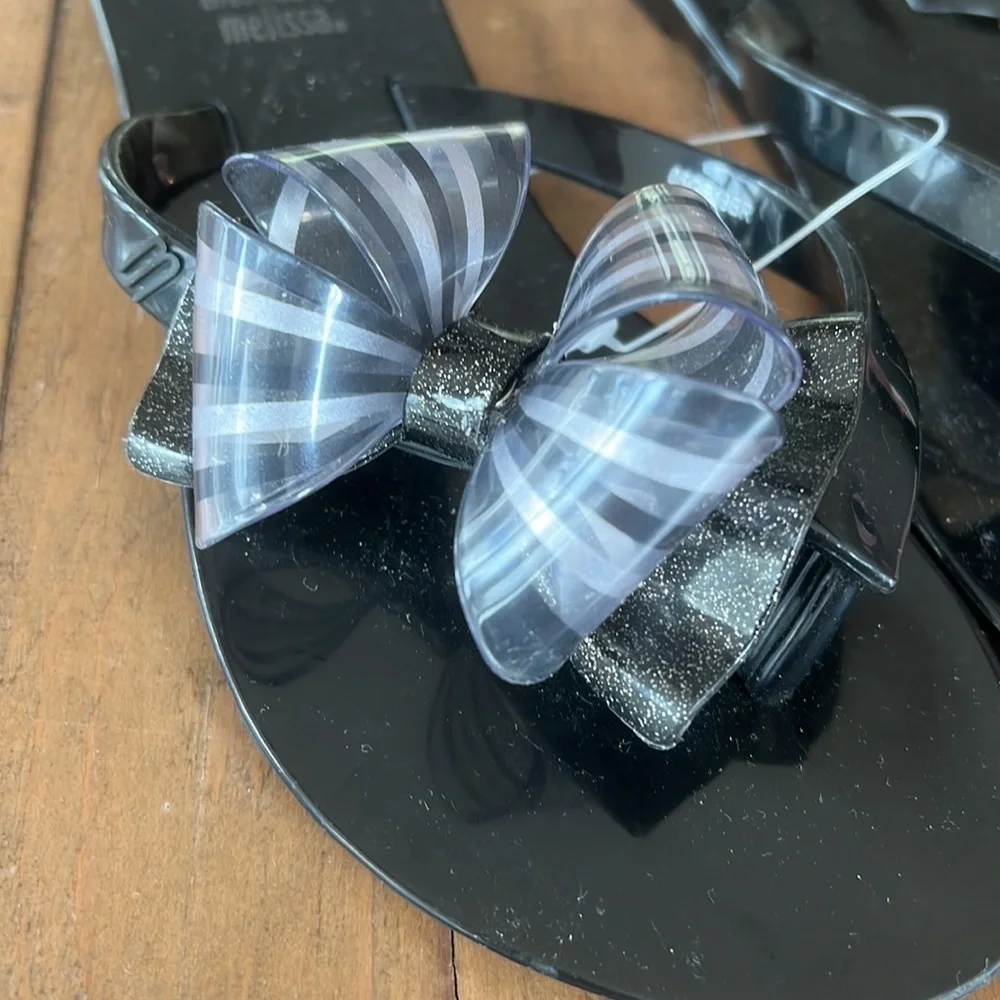 Mini Melissa Mel harmonic black bow flip flop sandals